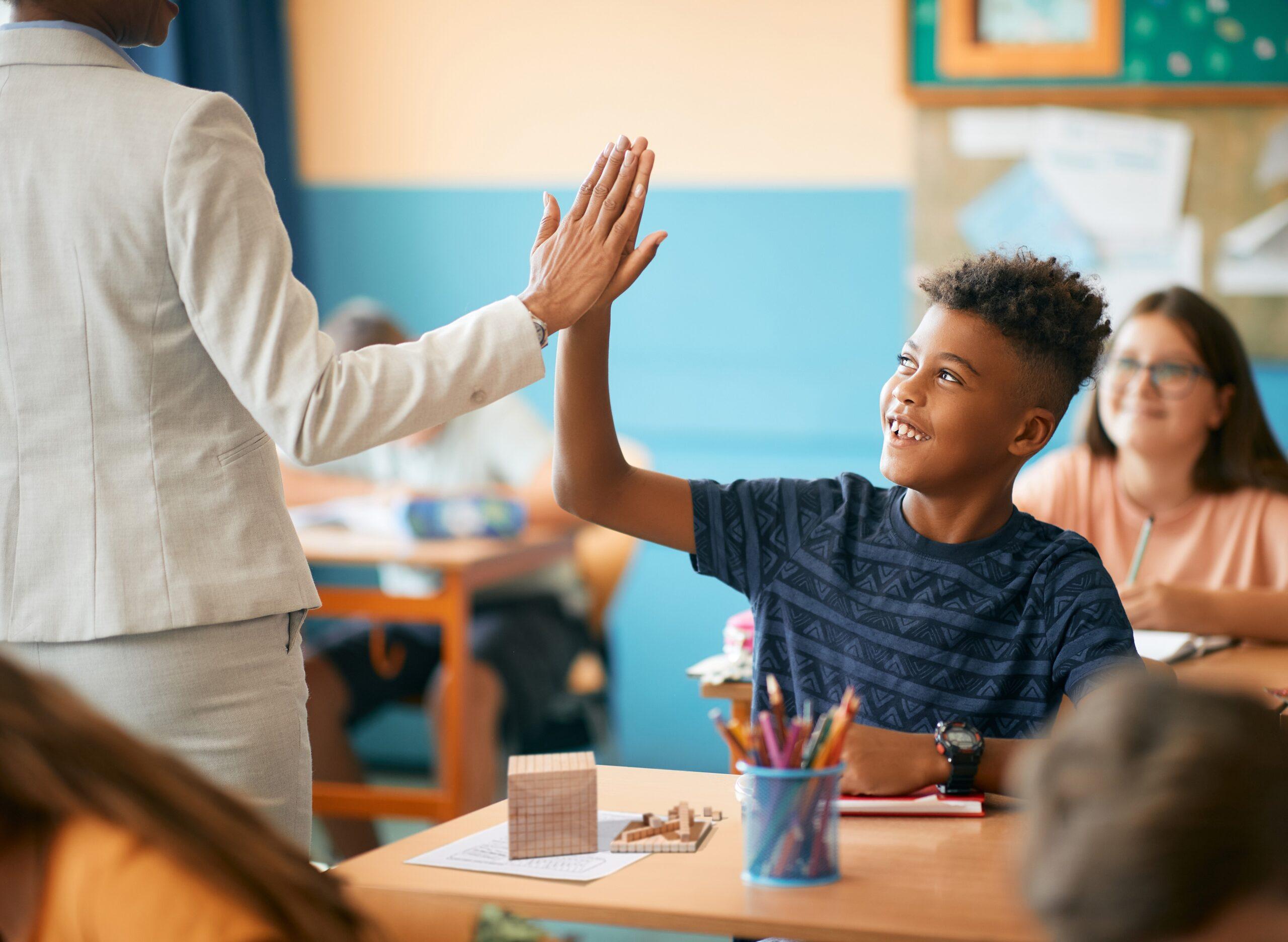 Student high-five meeting goals